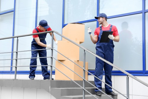 Professional flat removals in Castelnau with moving boxes and furniture