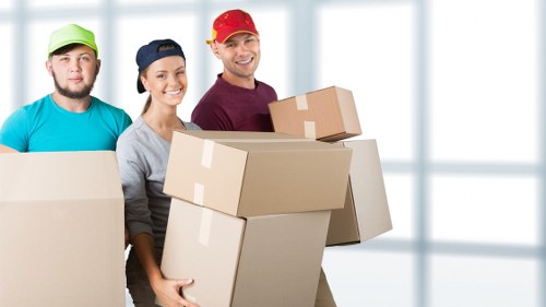Professional movers handling furniture during Castelnau house removals
