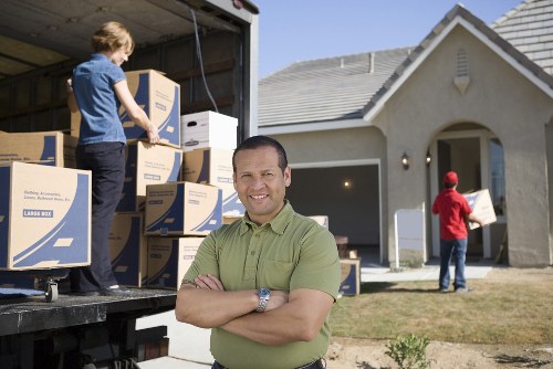 Professional movers handling furniture during a Castelnau relocation