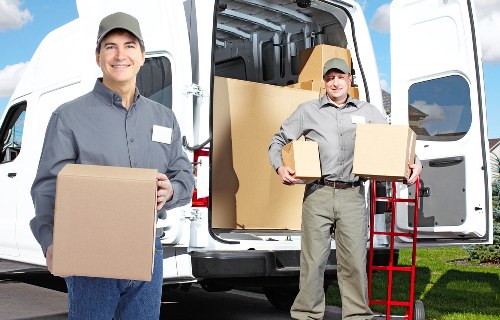 Safe manual handling and aisle management in a storage unit